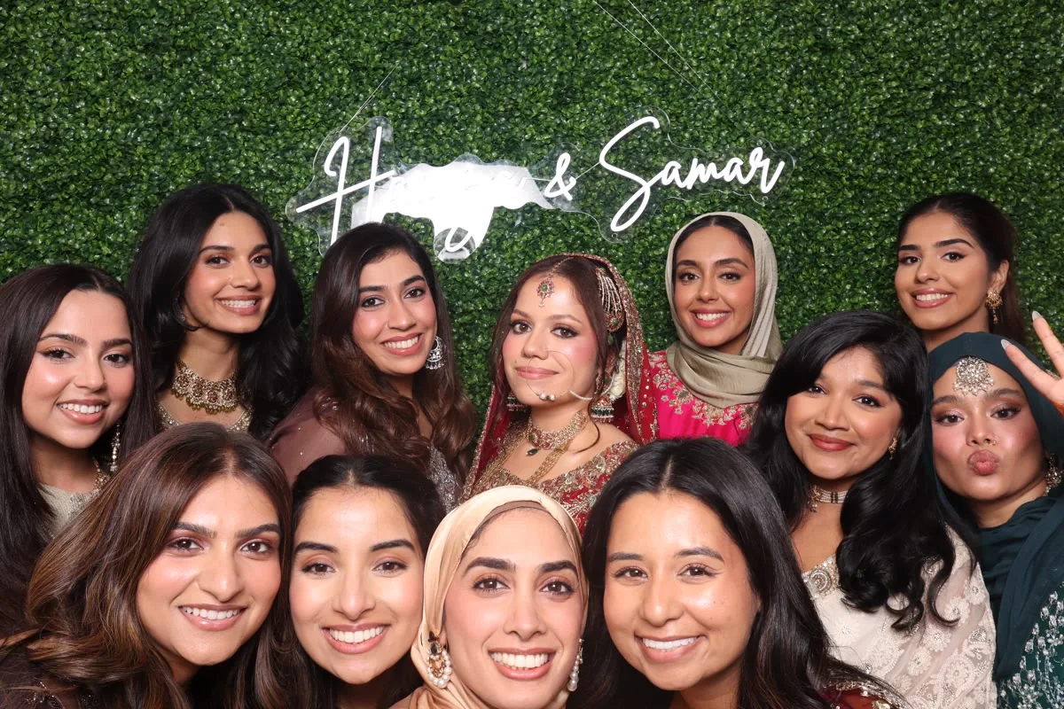 Clutch City luxury photo booth with greenery wall at Houston event